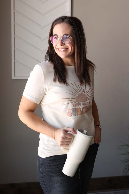 Boost your energy and style with our "Bring On The Sunshine" tee! Made with slim-fit Bella Canvas material, this motivational shirt is perfect for everyday wear. Don't wait, grab yours today and spread the happy vibes. Remember to size up for the perfect fit, as they are a slim-cut style. Classy Closet online women's boutique clothing store for cute spring summer outfits, mom outfits, and modest fashion!