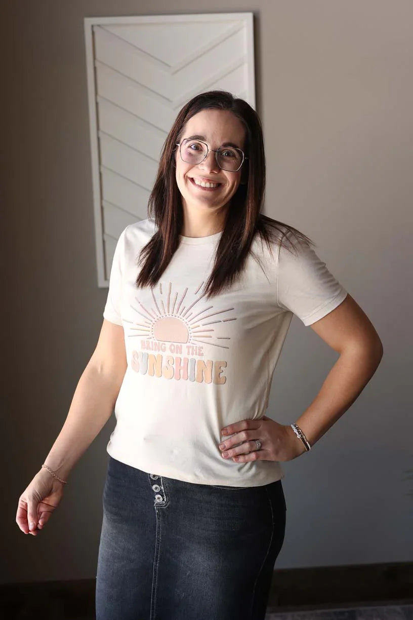 Boost your energy and style with our "Bring On The Sunshine" tee! Made with slim-fit Bella Canvas material, this motivational shirt is perfect for everyday wear. Don't wait, grab yours today and spread the happy vibes. Remember to size up for the perfect fit, as they are a slim-cut style. Classy Closet online women's boutique clothing store for cute spring summer outfits, mom outfits, and modest fashion!