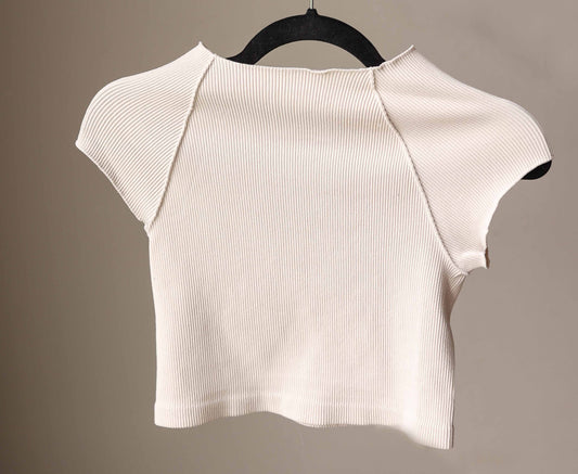 This Sand Beige Ribbed Short Sleeve Half Tee is designed for comfort and style. Its ribbed, stretchy fabric offers a snug, fitted look that layers effortlessly without adding bulk. Perfect for nursing moms too!