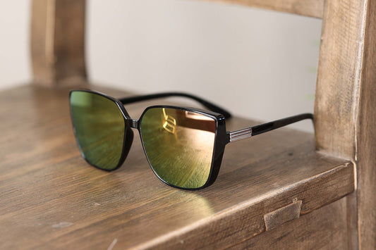 Are you looking for a stylish and comfortable pair of sunglasses? Look no further than our Cleo Sunglasses! With their trendy cat eye style and lightweight design, these sunglasses are perfect for any fashion-forward individual.
But that's not all, these sunglasses also feature mirror lenses that not only look cool but also provide protection from the sun's harmful rays. 
And with no nose piece, you'll never have to worry about discomfort or an ill-fitting pair of sunglasses.
Made with durable PC an