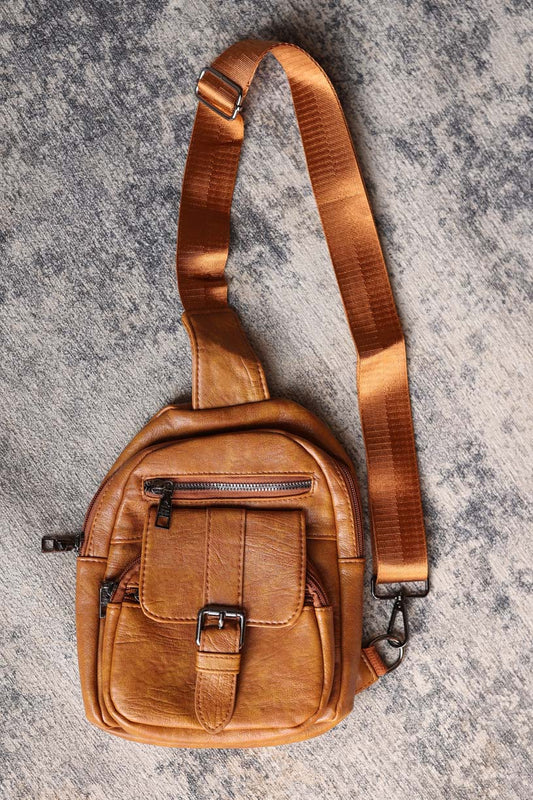 Effortlessly cool and functional, our Khaki Vintage Sling Bag is the perfect accessory for a laid-back and stylish look. With cargo-inspired features, this crossbody bag adds a fun and modern touch to any outfit. Perfect for everyday use with a casual yet trendy vibe. Classy Closet online women's boutique for modest fashion fall winter 2024