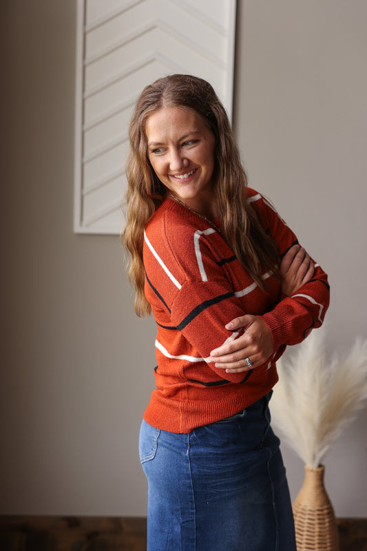 The Coffee Multi Stripe Sweater is a lightweight, breathable fabric perfect for all-day comfort and stylish layering.