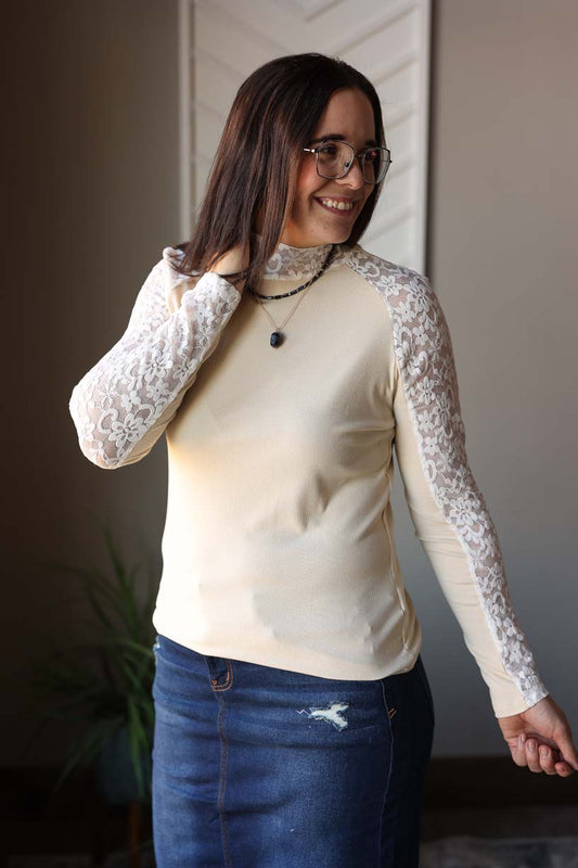 Elevate your style with our Beige Floral Lace Long Sleeve Top. This chic and trendy top features a subtle ribbed body, lace long sleeves, and slight mock neck. Perfect for layering or wearing alone, it's versatile and adds a touch of style to any outfit. Size up two for a fashionable look, as shown, or size up one for a more fitted, layering piece. Classy Closet online women's boutique clothing store with cute trendy and modest fashion style for everyday mom outfits, teacher outfits, and church outfits.