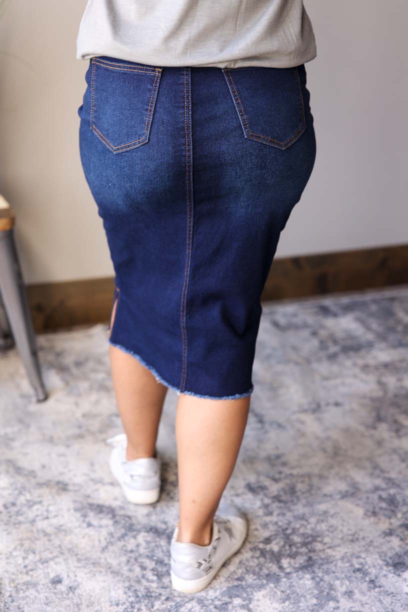 Becca Dark Wash Side Slit Denim Skirt. This stylish jean skirt features a dark wash for a sleek and sophisticated look that you can wear to work, school, or date night for fall winter outfits.