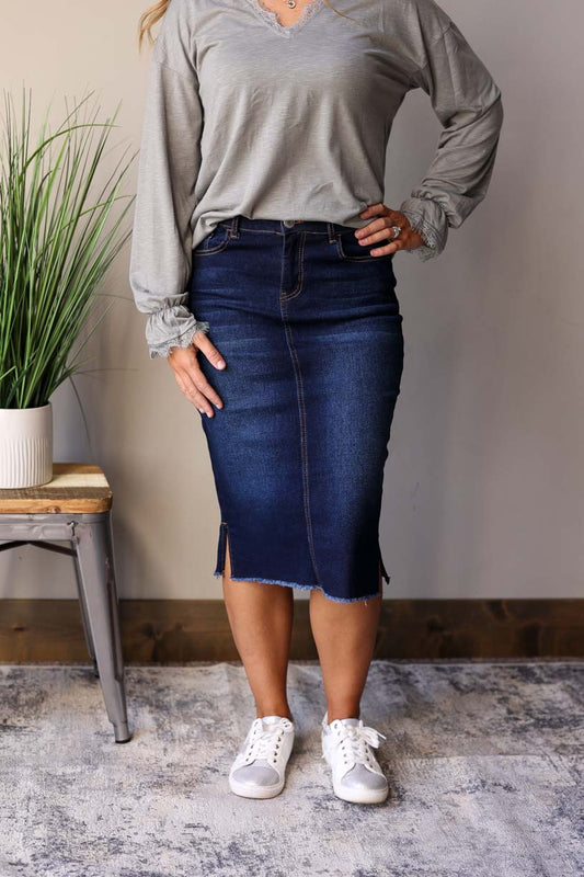Becca Dark Wash Side Slit Denim Skirt. This stylish jean skirt features a dark wash for a sleek and sophisticated look that you can wear to work, school, or date night for fall winter outfits.