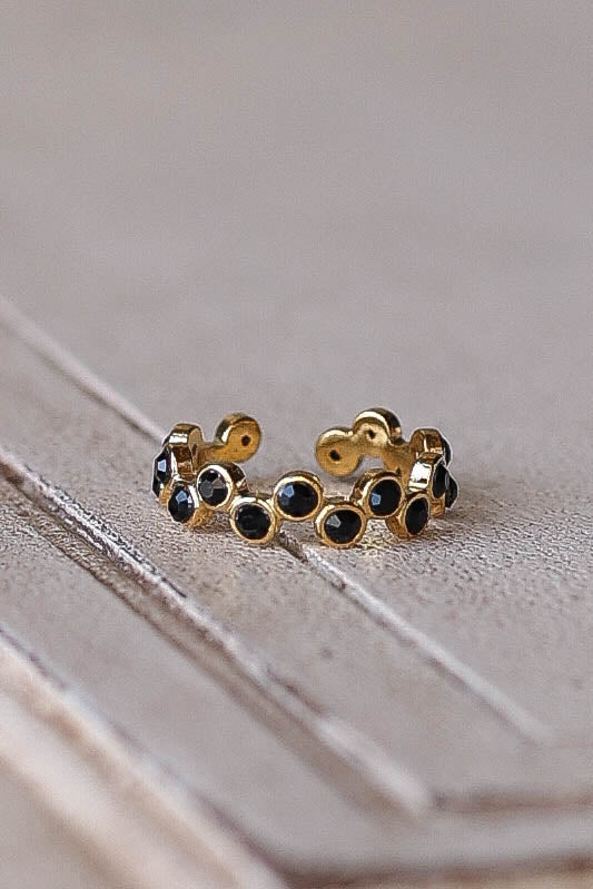 Meet the Annabelle Ring, a stunning addition to any jewelry collection. This adjustable stainless steel ring features a unique offset pattern of black glass stones, creating a striking contrast that adds sophistication and edge to your look. Designed with versatility in mind, the Annabelle Ring is perfect for stacking with other rings or wearing solo for a bold statement. * Stainless Steel * Adjustable * Nickel Free
"All of our rings are gold plated stainless steel. Because stainless steel is a strong mate