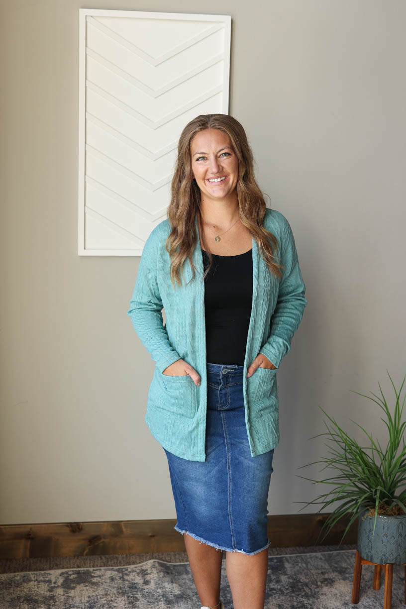 Add some cheerful color to your closet with our Blue Green Textured Open Front Cardigan. Stay comfy and put-together with its unique design. Perfect for adding a fun and stylish touch to any winter look. Classy Closet online boutique midwest for cute mom fall winter outfits and modest fashion.