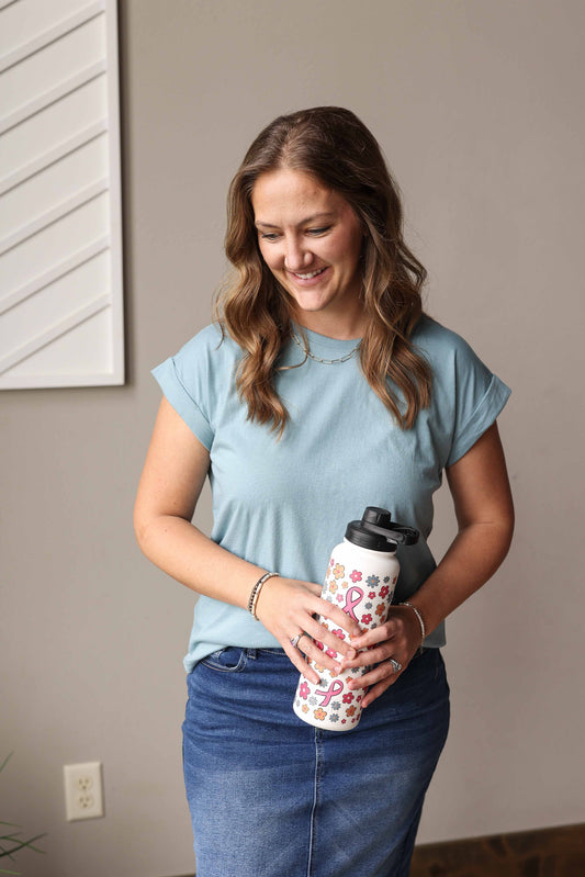 Elevate your wardrobe with our Blue Grey Rolled Sleeve Tee. Perfect for any occasion, its versatility allows for effortless style. Made from soft, comfortable fabric, this tee is a wardrobe must-have. From casual outings to work meetings, this top has got you covered with its classic yet trendy design. Classy Closet online boutique for modest cute mom outfits summer 2025