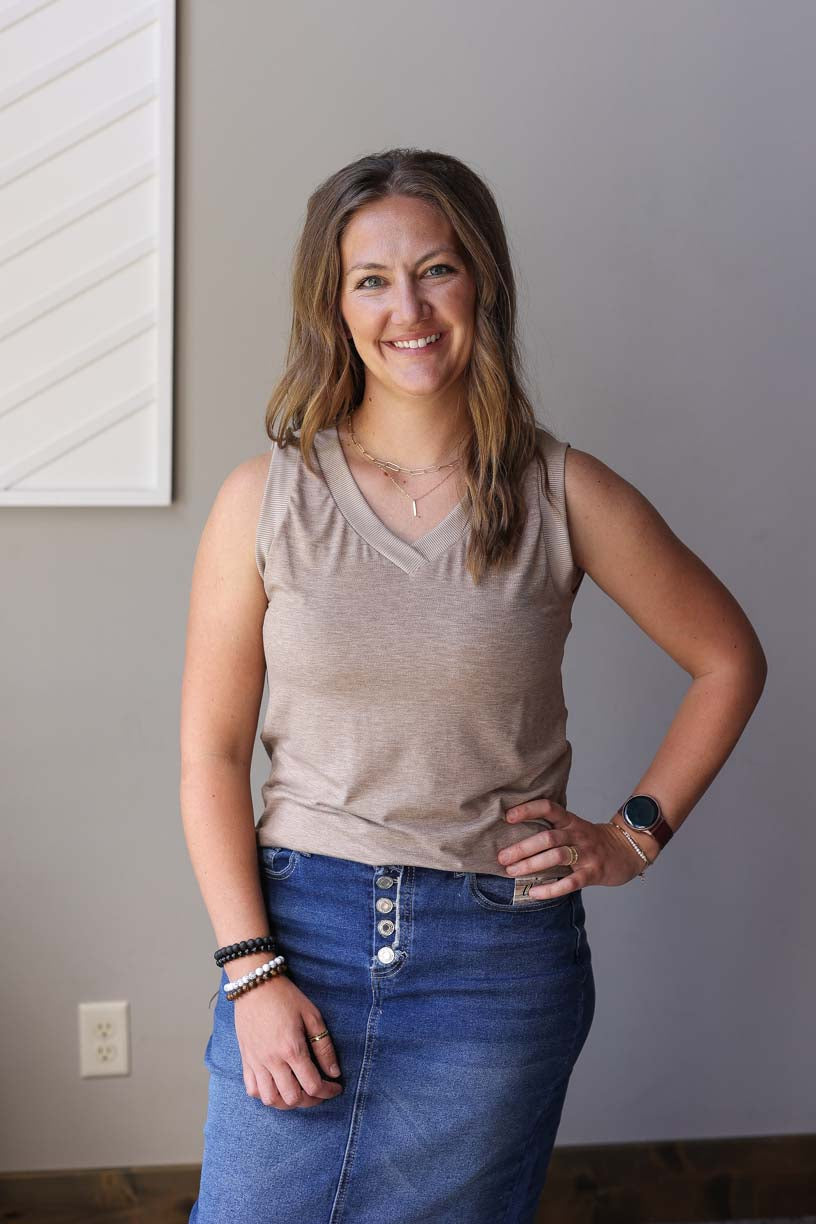 Upgrade your summer wardrobe with our Taupe Brown Ribbed Tank! Whether you're headed to the park or the office, this versatile tank has got you covered. With its back coverage, wide sleeves, and non-low v-neck, it's perfect for any occasion. Get ready to make it your go-to top this season!