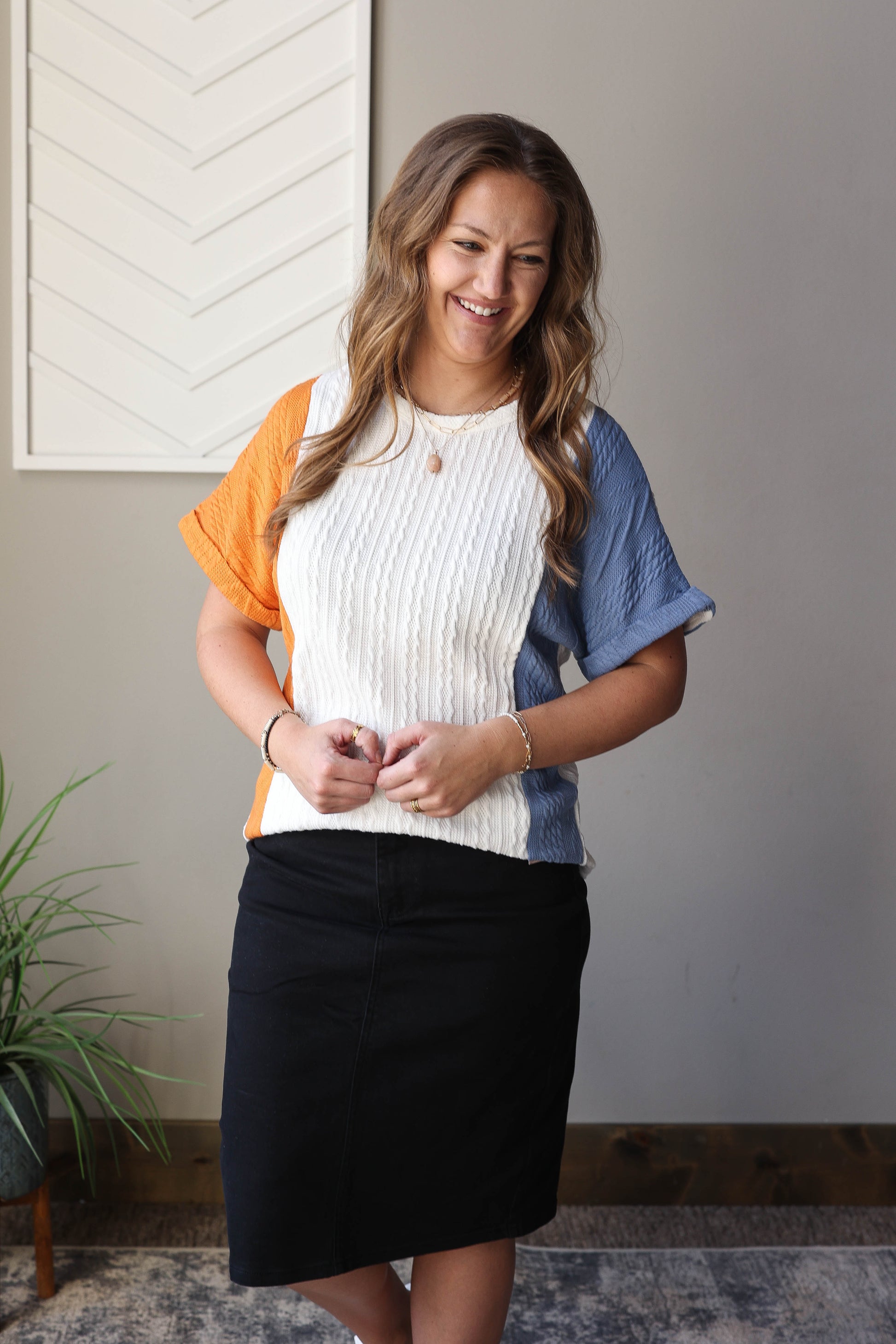 Stay stylish in our Blue Textured Colorblock Top! Made from a medium weight fabric, it offers the perfect amount of texture. Featuring rolled sleeves and a chic colorblock design, easily dress it up or down for any occasion. Comfort and versatility in one top.