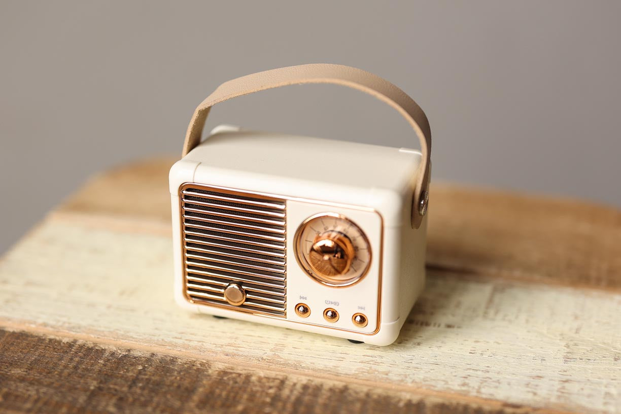 Introducing the Cream Retro Mini Wireless Bluetooth Speaker - not only does it deliver great sound, but it also adds a touch of cute retro style to any desk or office space. Enjoy your music with this adorable speaker, or use it as a fun decoration. Classy Closet Online Boutique for Cute Casual Women's Clothing in iowa