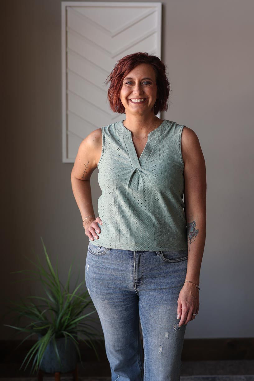 Update your summer wardrobe with our Mist Green V-Neck Tank Top. This cute and chic piece is perfect for any occasion - whether it's a day at work, date night, or a brunch with friends. Made with a soft mist green fabric and feminine eyelet texture, it's stylish and versatile for any setting. Don't miss out on this must-have addition to your closet. Classy Closet online women's clothing boutique for modest fashion in rock valley iowa