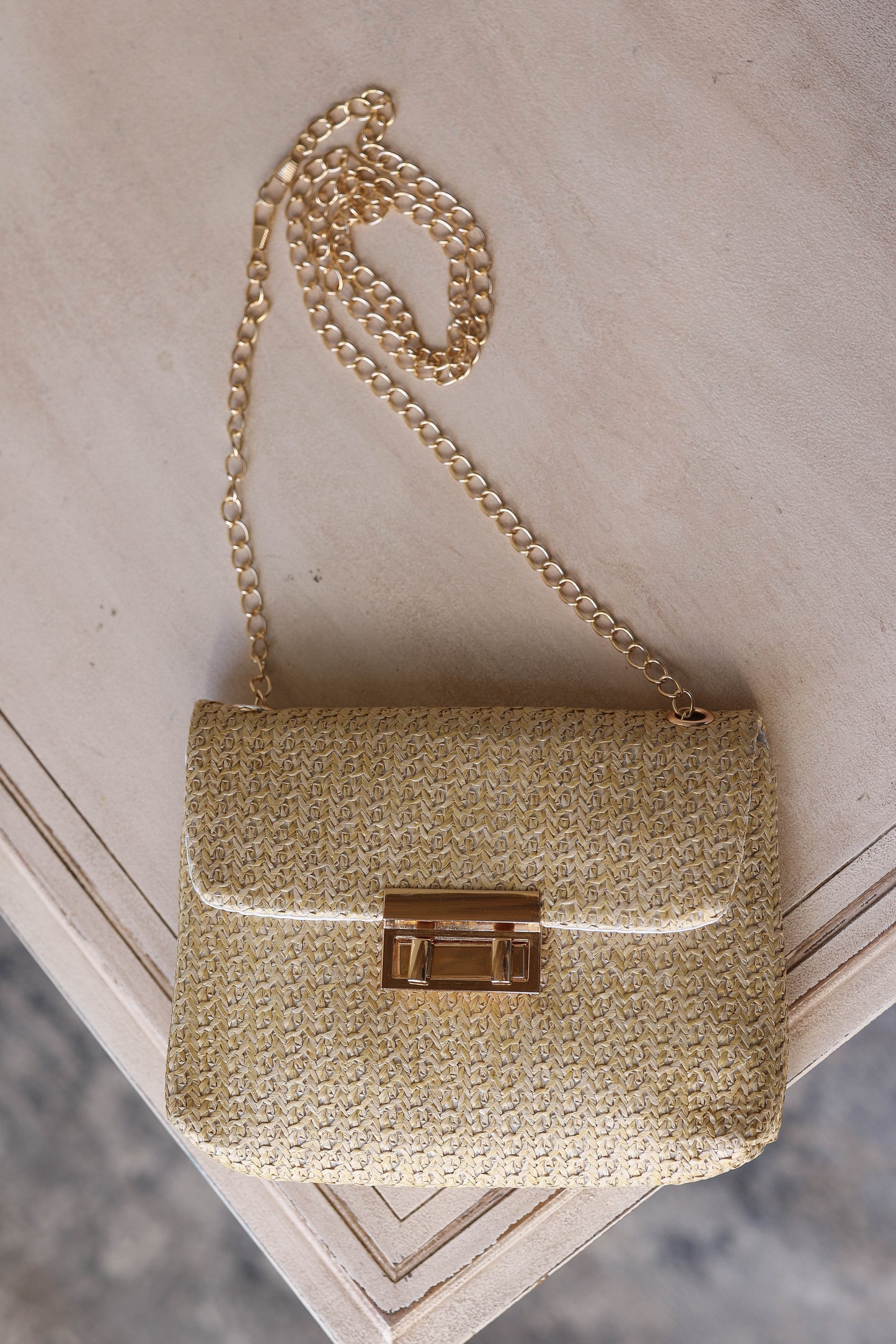 Elevate your style with our chic Camel Woven Chain Strap Purse. Perfect for events, church, dates, and more, this smaller size clutch features a stylish gold strap for a touch of elegance. Stay fashionable and organized on the go with this fun accessory. Classy Closet online clothing boutique for cute affordable spring tops 2025. hull iowa