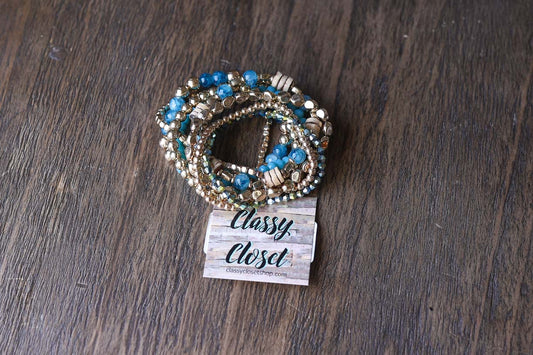 This adorable set of gold and teal elastic bracelets brings instant joy to any outfit! Wear them individually for a subtle touch or stack them all together for a bold boho statement. These versatile accessories effortlessly mix and match, adding a playful yet chic element to your everyday style. Perfect for brightening your look with minimal effort!