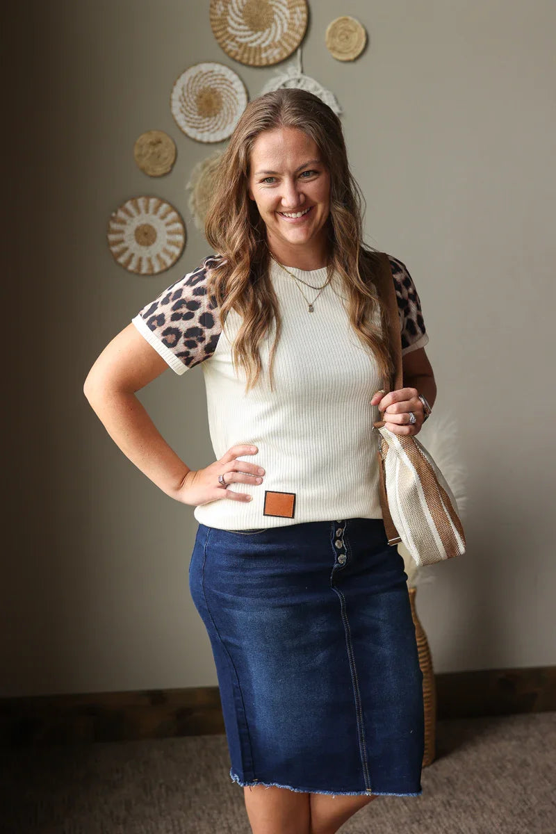 beige ribbed leopard contrast sleeve top with patchwork detail for summer outfits with button fly denim skirt