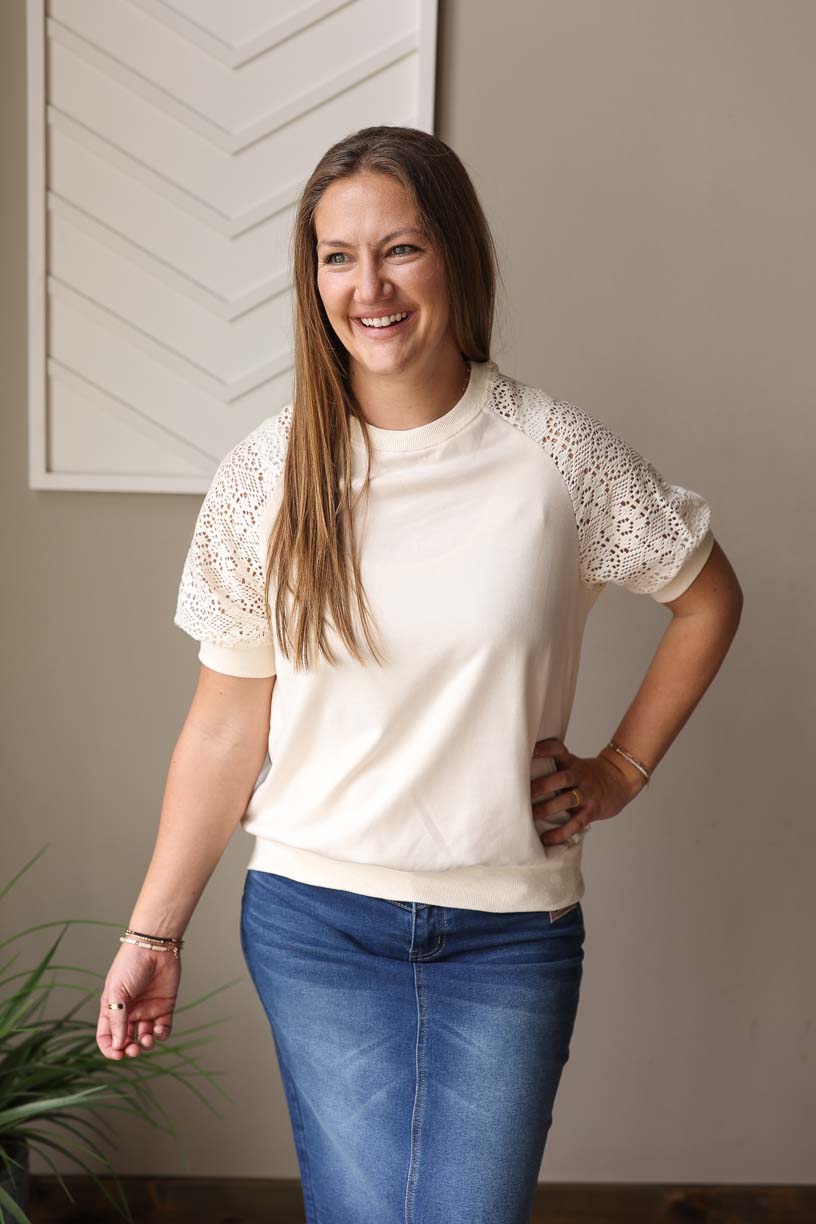 This Beige Lace Crochet Short Sleeve Top adds a touch of chic to any outfit. The versatile styling options make it a great addition to any wardrobe, and the band around the bottom adds a unique touch. With its longer crocheted sleeves, you can stay covered but still feel breathable. Perfect for any casual or dressed up occasion!