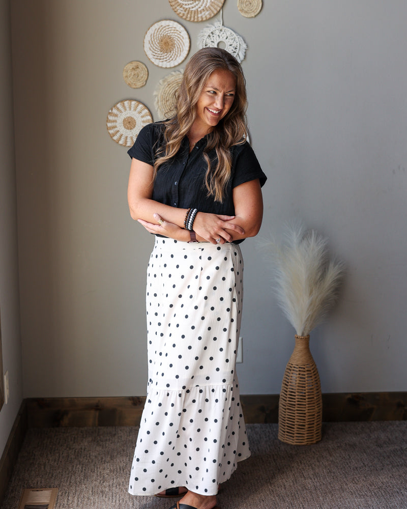off white black polka dot maxi skirt with side slits paired with a black button up gauze top