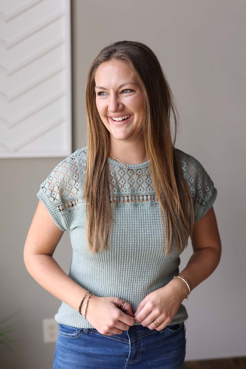 This versatile top will take you from church to work to date night in comfort and style. The lace shoulder and chest detail add a touch of chicness, while the soft waffle material is perfect for all day comfort. Available in sizes S-2XL PLUS, this top is perfect for any occasion.