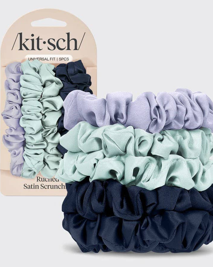 Set of scrunchies with packaging displaying 'kit-sch' brand on a light gray background