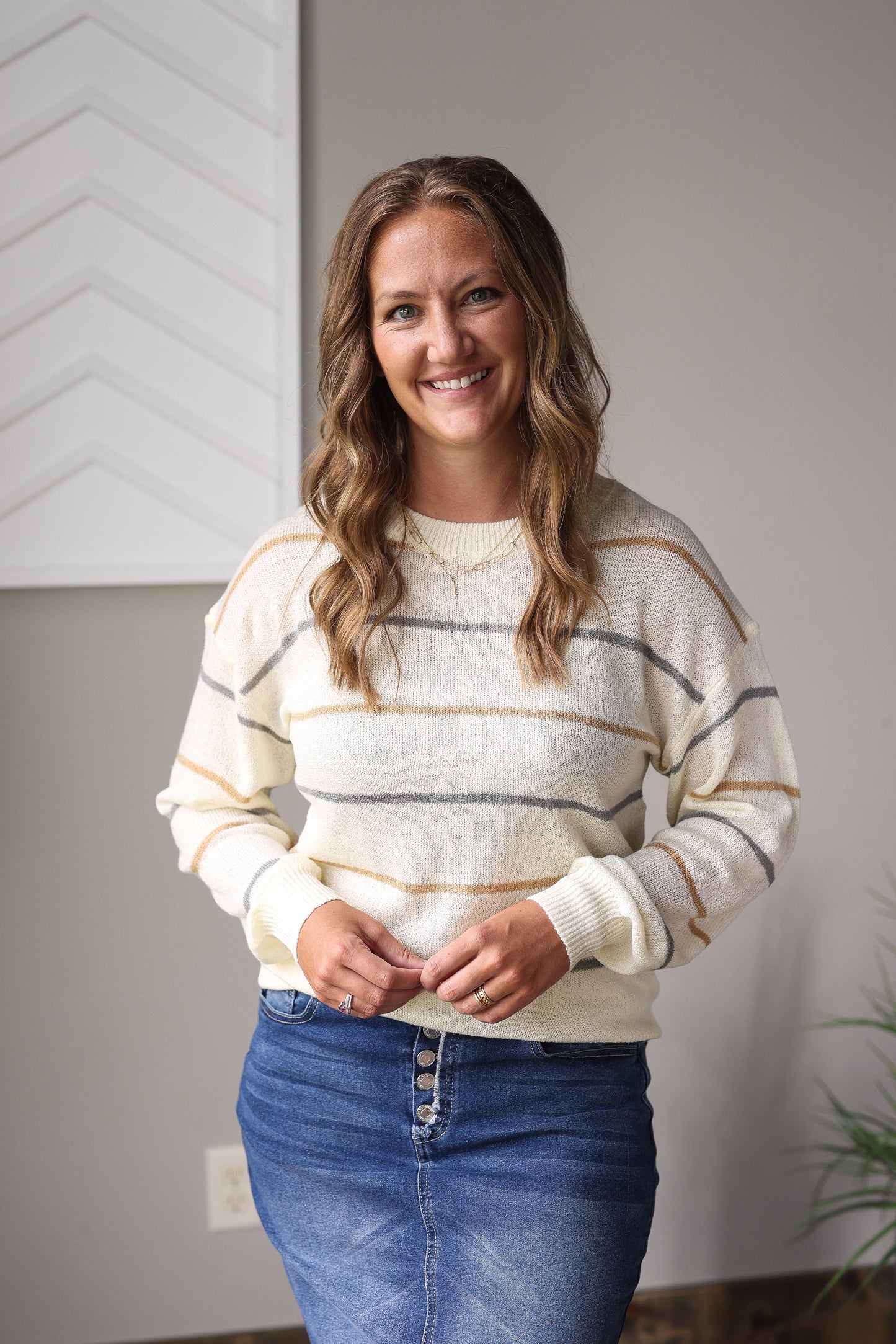 Modest multicolor striped fall sweater styled with denim skirt and ankle boots.