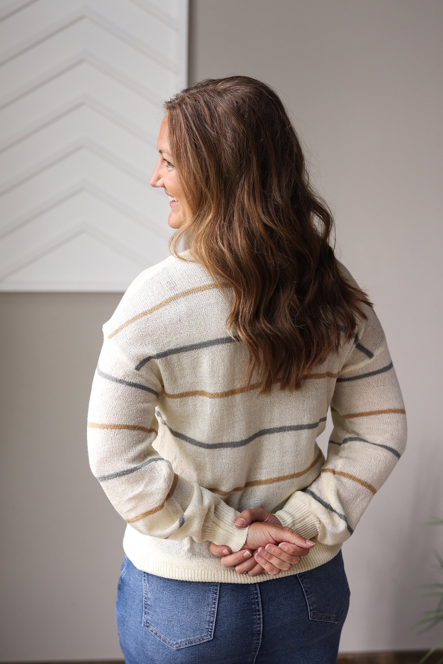 Modest multicolor striped fall sweater styled with denim skirt and ankle boots.