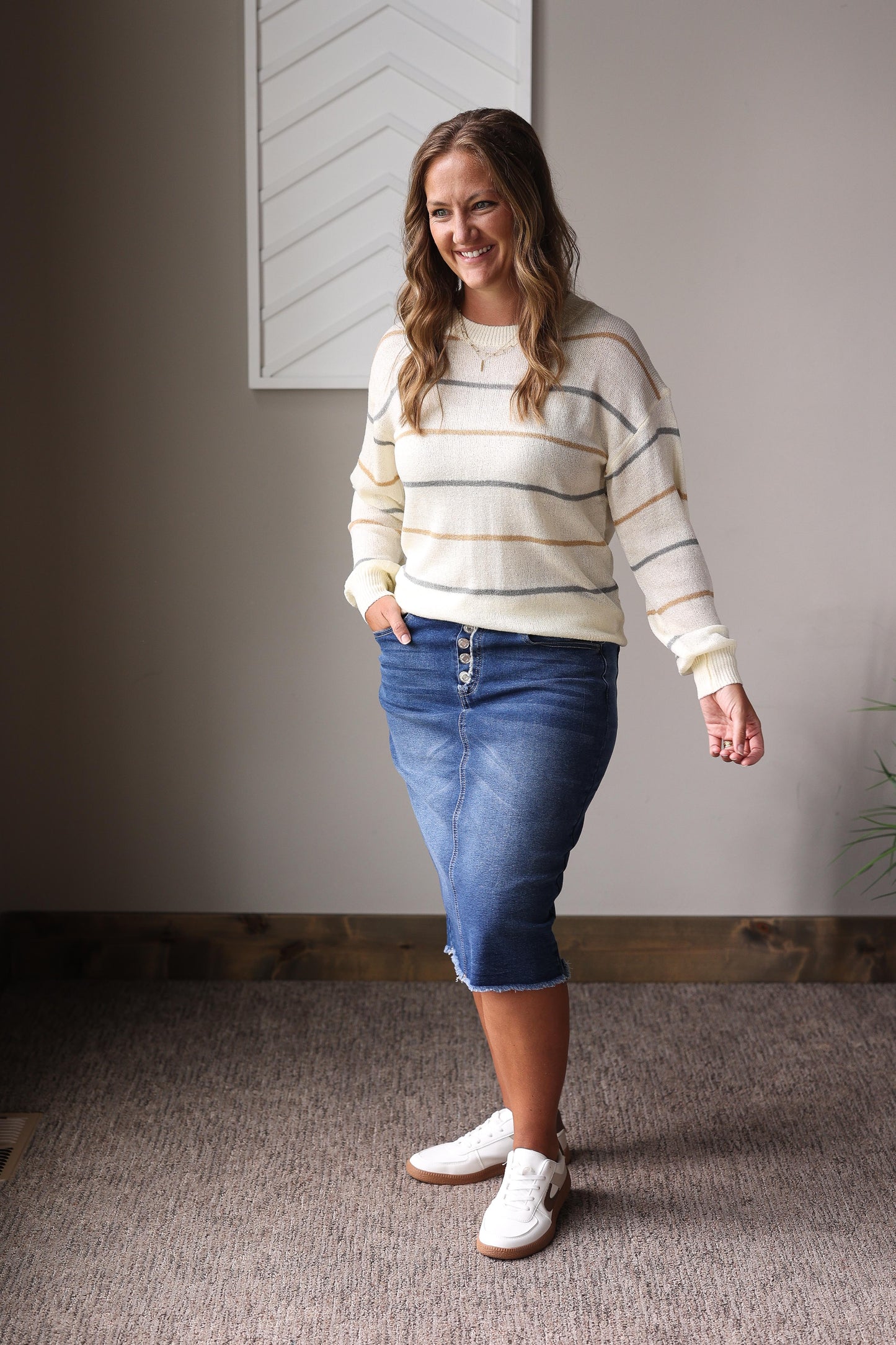 Modest multicolor striped fall sweater styled with denim skirt and ankle boots.
