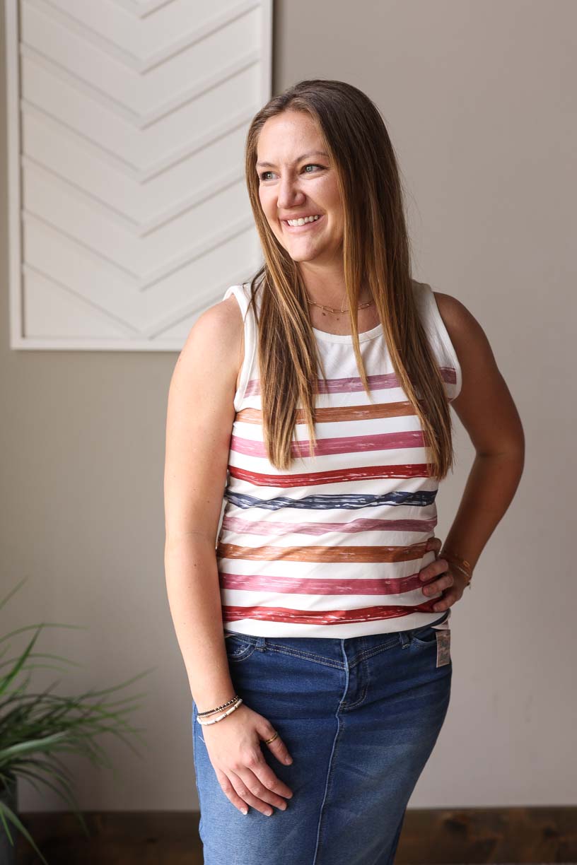Introducing the cute and modest Multicolor Strip Crewneck Tank! This versatile tank top features wide sleeves and a crewneck, perfect for wearing alone or layering with its multi-colored stripes. With so many color choices, effortlessly mix and match for a stylish and effortless look.