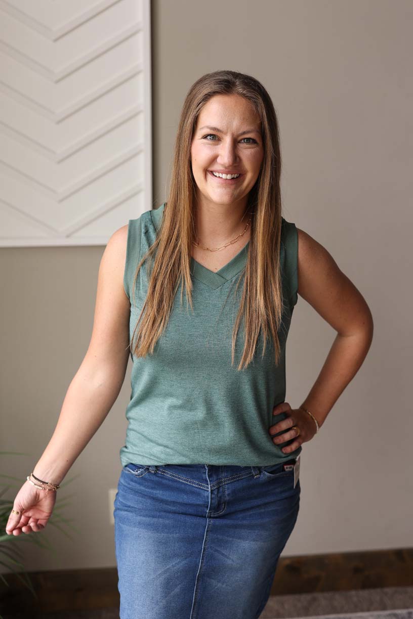 Upgrade your summer wardrobe with our Mist Green Ribbed Tank! Whether you're headed to the park or the office, this versatile tank has got you covered. With its back coverage, wide sleeves, and non-low v-neck, it's perfect for any occasion. Get ready to make it your go-to top this season!