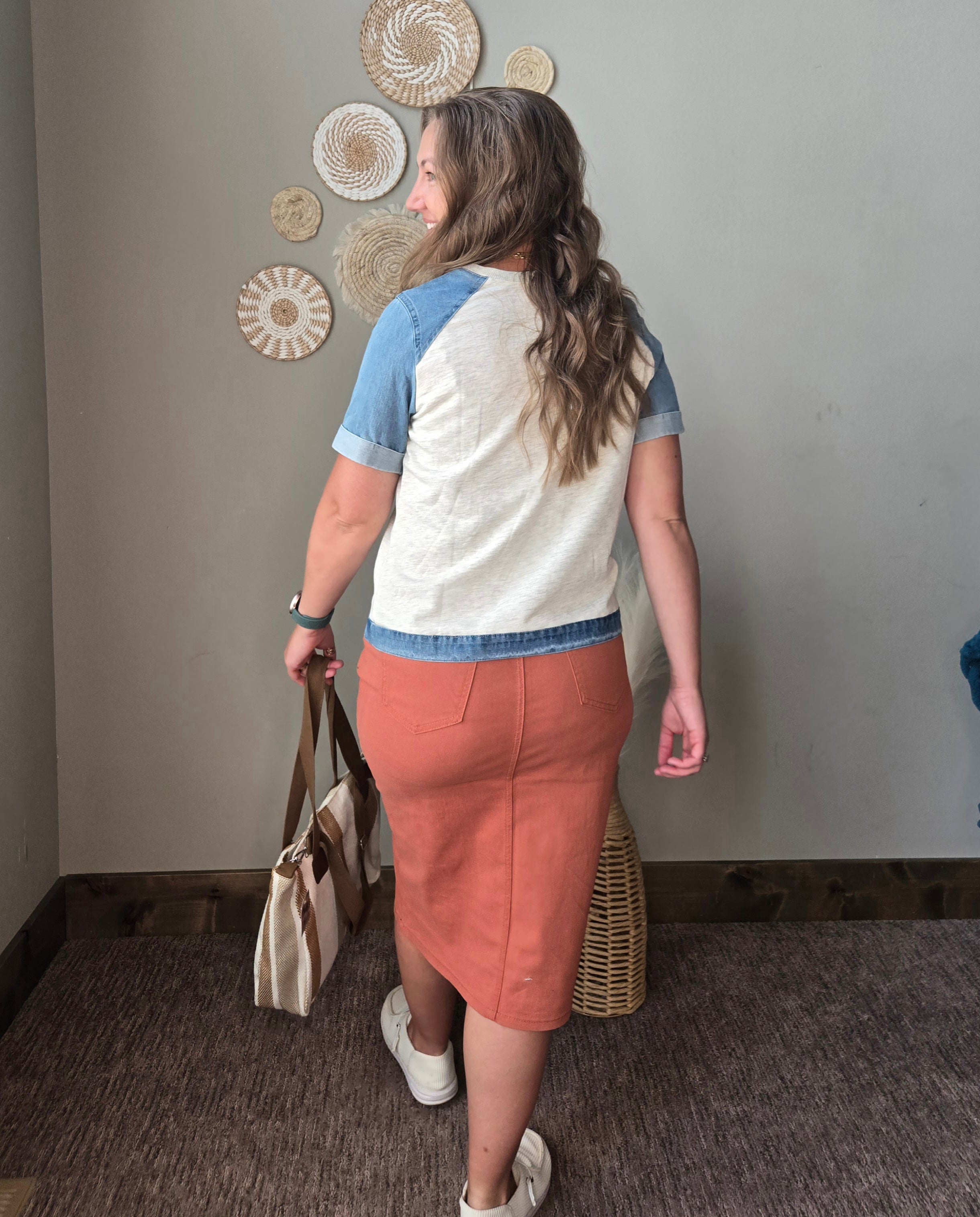 grey denim contrast short sleeve patchwork summer top with orange rust colored denim midi skirt walking away