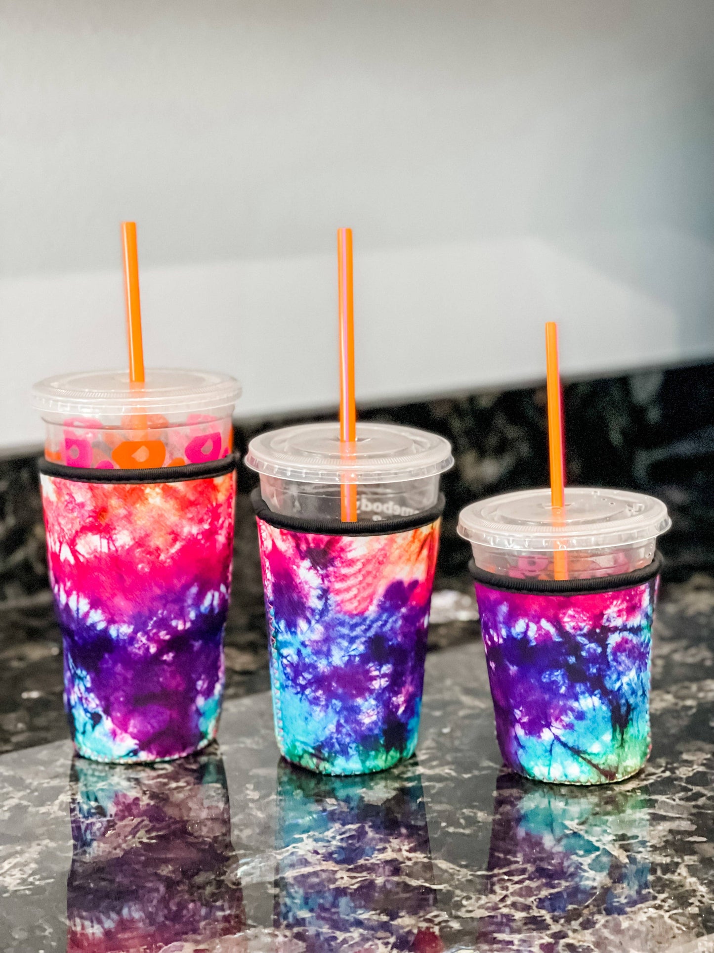 Save those hands holding those cold iced coffees! The are made of neoprene and are the perfect little beverage holders for the Summer or anytime!&nbsp; Small fits Dunkin 16oz and Starbucks Grande&nbsp; Medium fits Dunkin 24oz and Starbucks Venti&nbsp; Large fits Dunkin 32oz and Starbucks Trenta&nbsp;