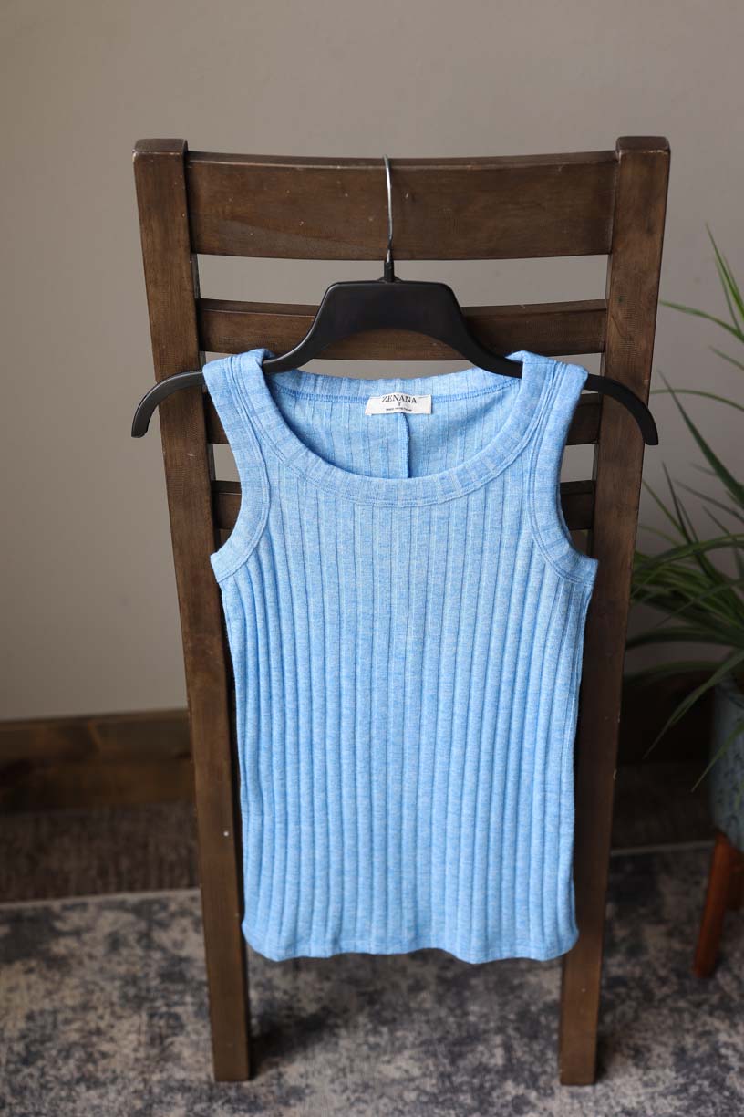 Get ready to feel cozy and chic in the Black Ribbed Square Neck Sleeveless Top. Made from super soft, sweater-like fabric, this tank top is perfect for all your summer layering needs. Stay comfortable and stylish without sacrificing style. Classy Closet Hull Iowa Boutique
