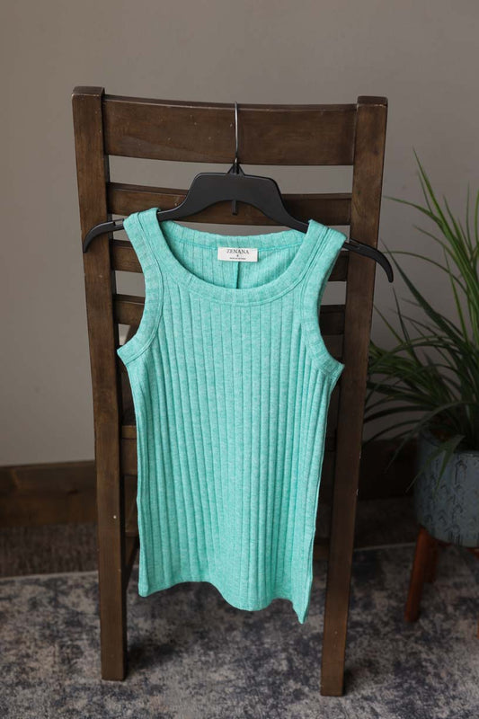 Get ready to feel cozy and chic in the Kelly Green Ribbed Scoop Neck Sleeveless Top. Made from super soft, sweater-like fabric, this tank top is perfect for all your summer layering needs. Stay comfortable and stylish without sacrificing style. Classy Closet Hull Iowa Boutique