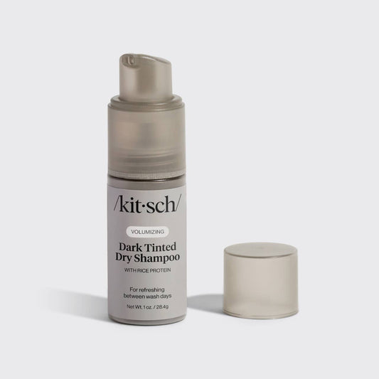 Kitsch dark tinted dry shampoo bottle on a light gray background