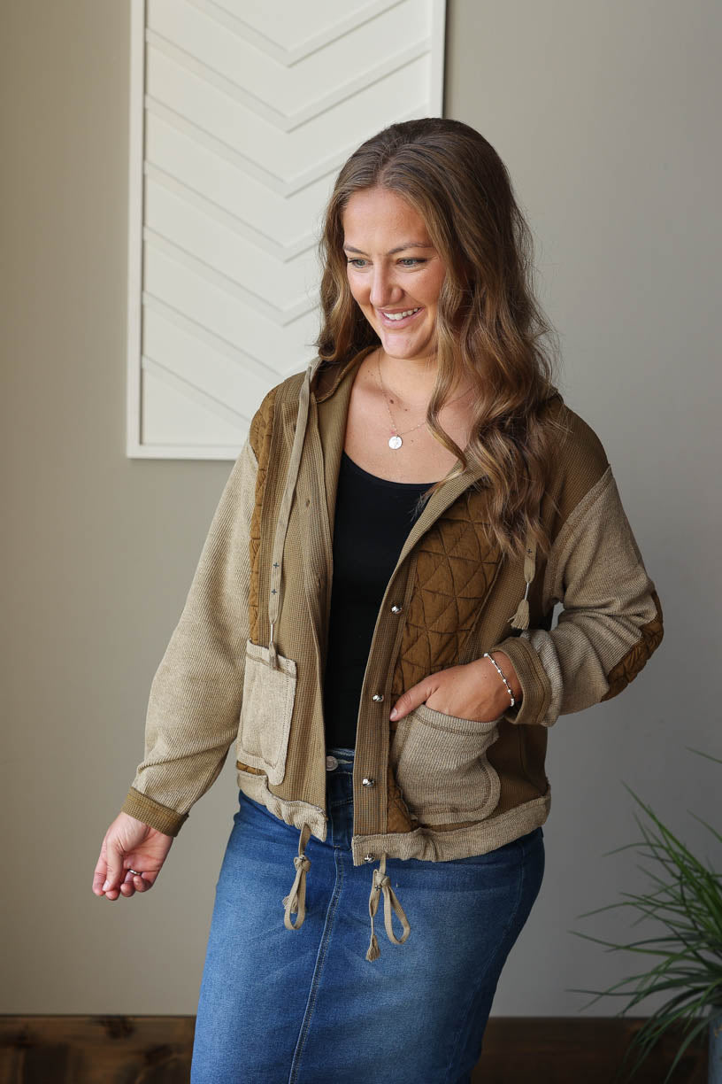 Stay warm and stylish this fall/winter with our Jungle Green Quilted Hooded Jacket! This sweatshirt-like jacket is packed with unique details, including elbow patches, a hood, and string accents. Perfect for a cozy and effortless look, it's the perfect addition to your wardrobe. Classy Closet online boutique midwest clothing for cute fall winter outfits for moms and modest fashion.