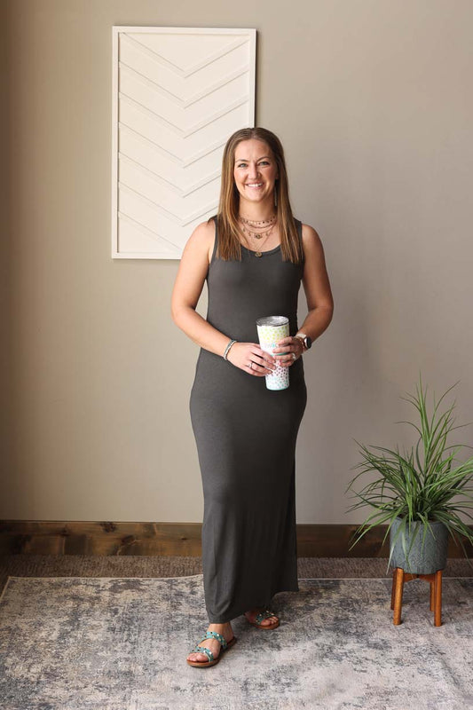 Effortlessly elevate your everyday style with our Ash Grey Sleeveless Scoop Neck Maxi Dress. Perfect for zoo trips, park dates, and more, this classic dress can be worn alone or layered with a blue or white denim jacket. Versatile and stylish, it's a must-have for any capsule wardrobe. Classy Closet Online Boutique Modest Dresses for Women