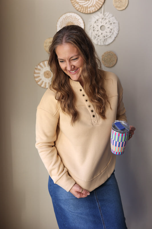 Beige Grommet Detail V-Neck Sweatshirt – Cozy comfort meets effortless style with this versatile wardrobe essential featuring trendy grommet accents and a flattering V-neckline.