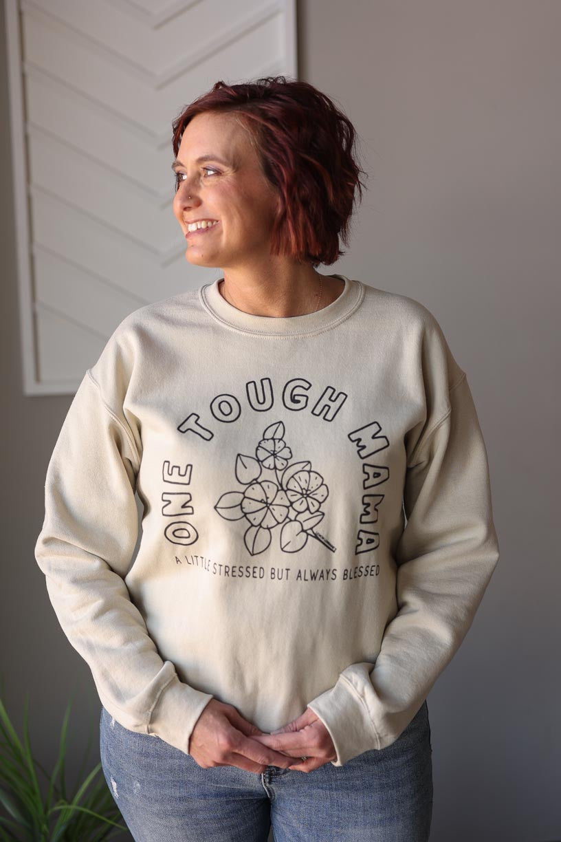 Stay stylish and comfortable with our Natural "One Tough Mama" Sweatshirt. Perfect for everyday mom life, this sweatshirt features a graphic design with a reminder that you are one tough mama, a little stressed, but always blessed. Stay confident and wear this sweatshirt with pride. ♥ Classy Closet online mom boutique for modest fashion and everyday chic styles with affordable tops and hard to find denim skirts. hull iowa