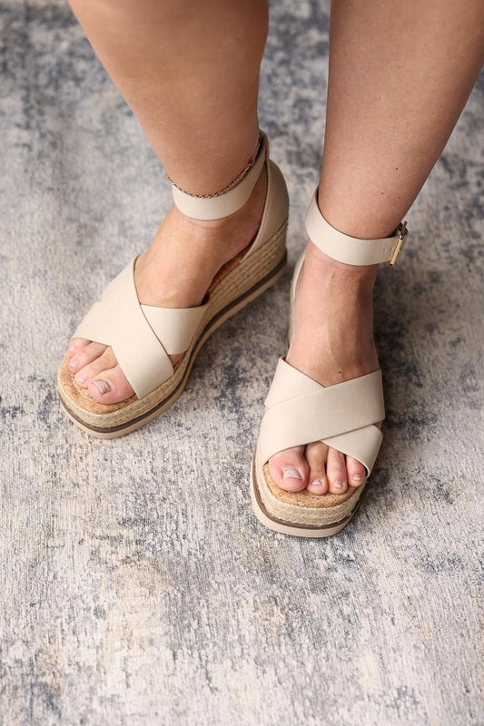 Step up (pardon the pun) your shoe game with our Beige Cork Low Wedge Sandals! 😉 Perfectly combining cute and comfy, these versatile sandals are perfect for any occasion - from church to date night to weddings. And with their neutral color, they'll match seamlessly with any outfit. Say hello to effortless style!