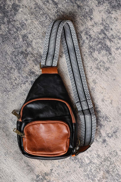 Elevate your style with our Black Contrast Patchwork Crossbody Bag. With its classy black and brown design, it's perfect for everyday life. Stay organized and hands-free while looking effortlessly chic. Classy Closet women's online boutique clothing for modest fashion and accessories.