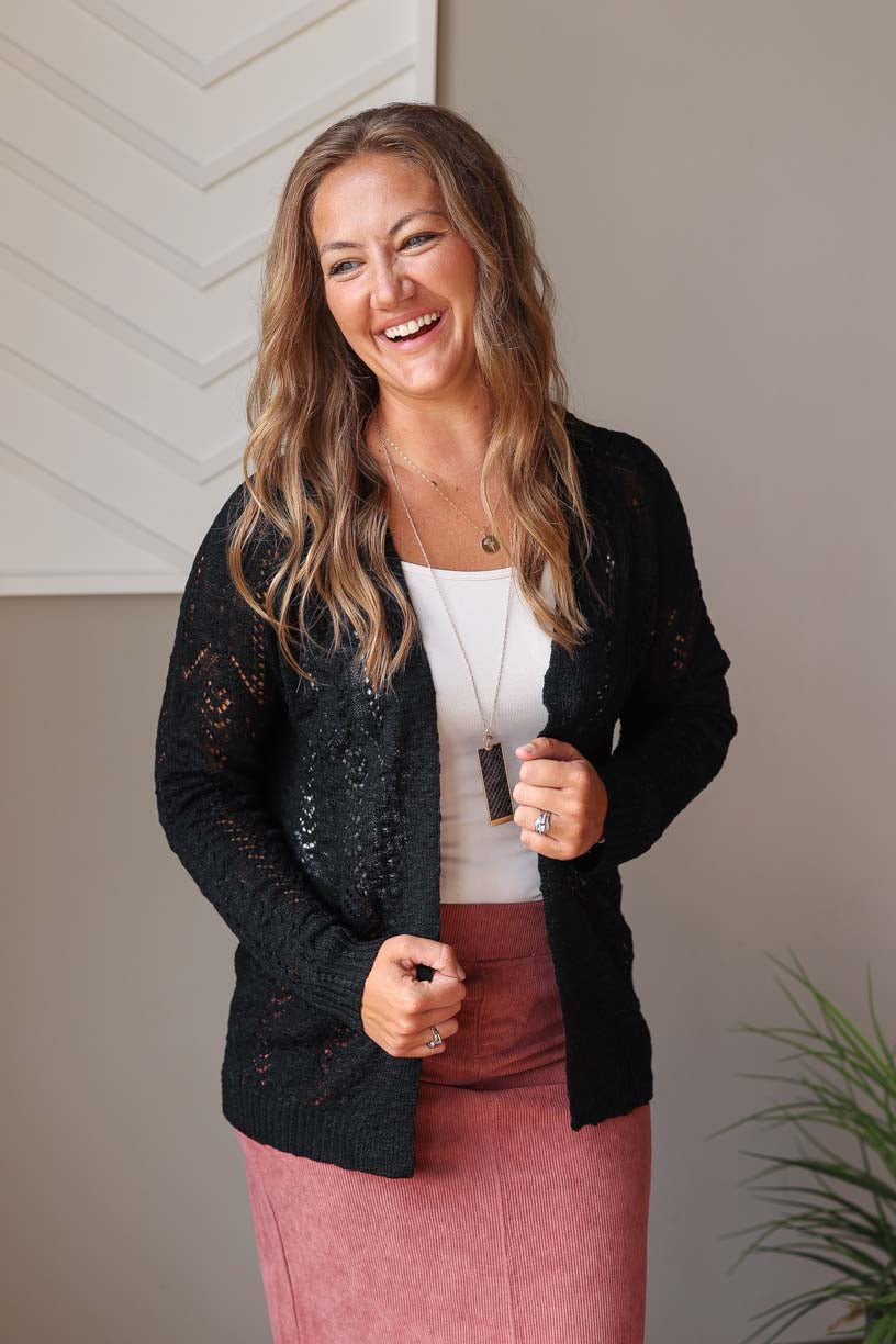 Effortlessly dress up any outfit with our Black Open Front Cardigan. Lightweight and stylish, this cardigan is perfect for all occasions, from school to work to church. Its classic design adds a touch of classy to any look. Classy Closet online women's clothing boutique for modest fashion and teacher outfits