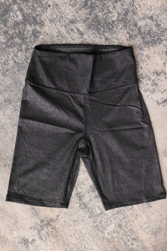 These high waist black biker shorts feature a subtle glitter print that adds a fun sparkle to your look. Designed with a snug, more controlling fit, they provide comfortable support while staying semi-slick to reduce cling under skirts and dresses.&nbsp;