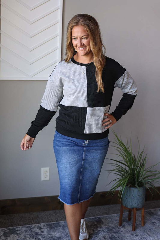 Upgrade your wardrobe with our Black Colorblock Textured Top! This versatile long-sleeve sweatshirt-style top is perfect for any occasion. Its chic colorblock design and textured material add a touch of style, while its comfortable fit makes it great for home, work, or date night. Stay comfy and fashionable all day long! Classy Closet online women's boutique for modest clothing and cute everyday mom outfits for fall winter