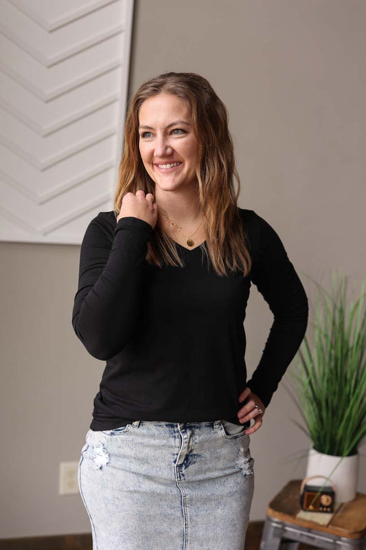 This Black V-neck Long Sleeve Layering Top is perfect for all your layering needs, whether it's with a vest, shacket, jacket, or wearing alone! It's the essential basic tee.