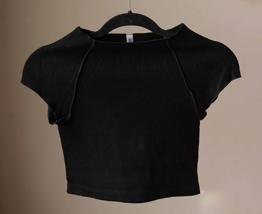 This Black Ribbed Short Sleeve Half Tee is designed for comfort and style. Its ribbed, stretchy fabric offers a snug, fitted look that layers effortlessly without adding bulk. Perfect for nursing moms too!