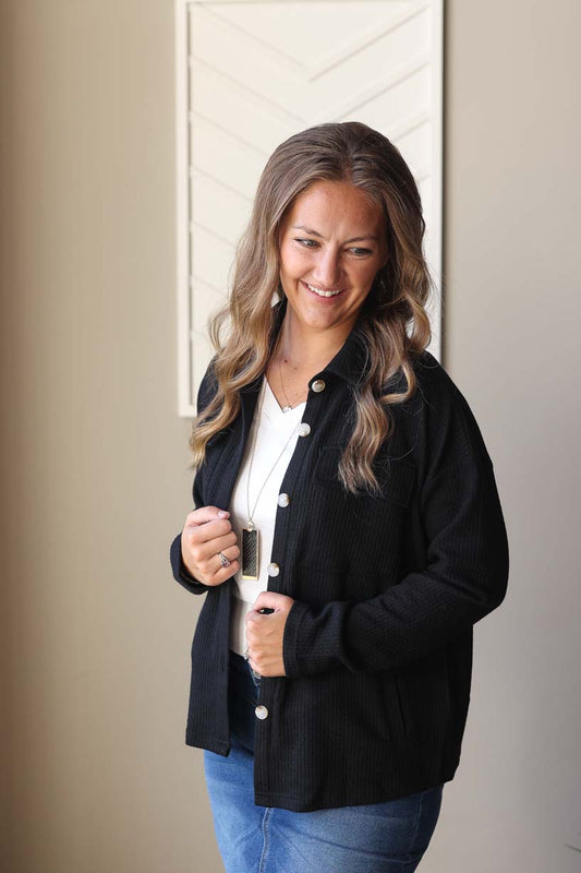 Effortlessly stylish and versatile, our Black Ribbed Knit Shacket is the perfect layering piece. Made from cozy and soft ribbed knit material, it features the added convenience of pockets. Dress it up or down for any occasion. Classy Closet Online Women's Boutique for Modest Fashion Clothing Fall Winter 2024