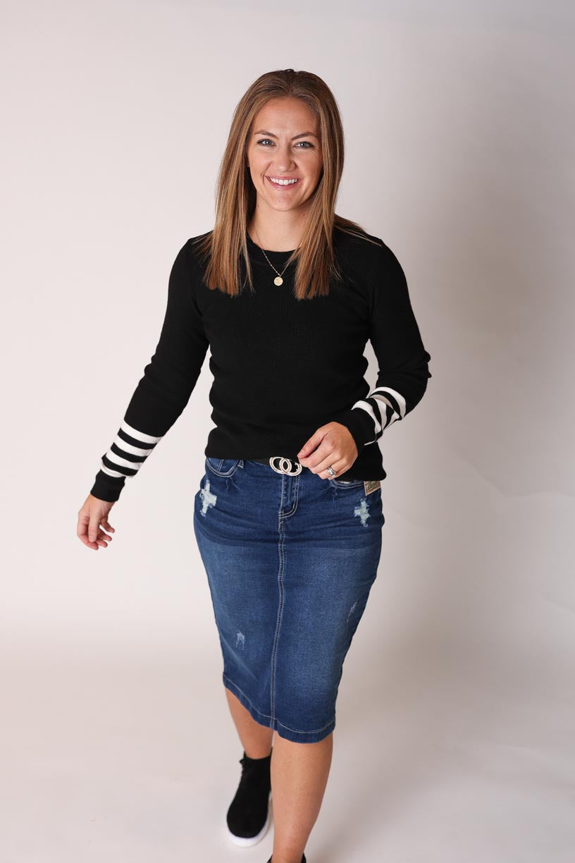 Black Striped Sleeve Sweater is perfect to wear for any occasion! Its solid black body and white stripes on the bottom of the sleeves give you many options for cute cold weather outfits this winter! 
