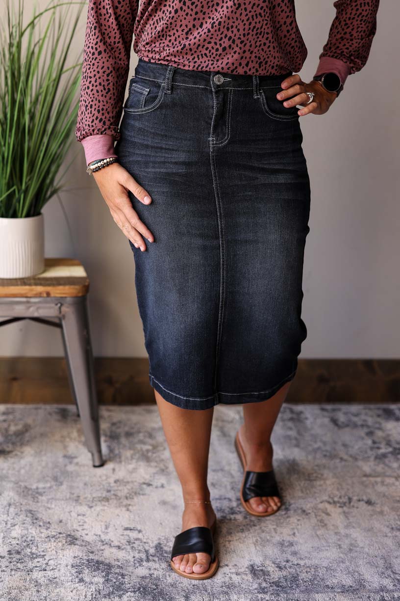 This Black Solid Midi Denim Skirt is a must-have item for any wardrobe. Classy Closet Online Women's Boutique for Modest Fall Winter Fashion