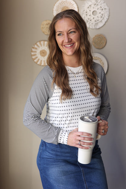 Black stripe raglan sleeve top with relaxed fit styled for everyday casual wear