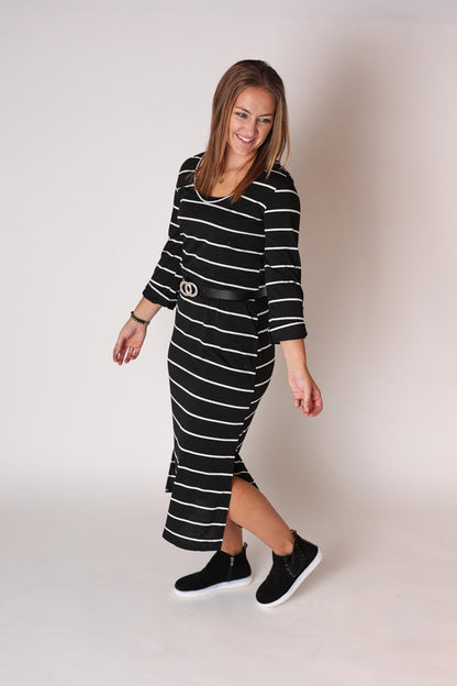 This black and white striped midi maxi dress is the perfect combination of cute and comfy for modest work outfits women winter at Classy Closet Boutique.