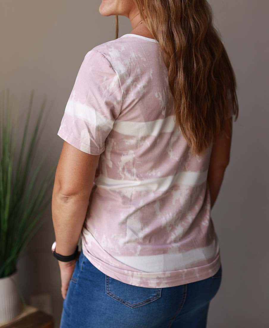 This blush tie dye Henley top makes casual mom life look good! Made from soft and stretchy material, it offers a classic fit and a cozy touch of fun. Women's Clothing Boutique Online for Modest Fashion at Classy Closet